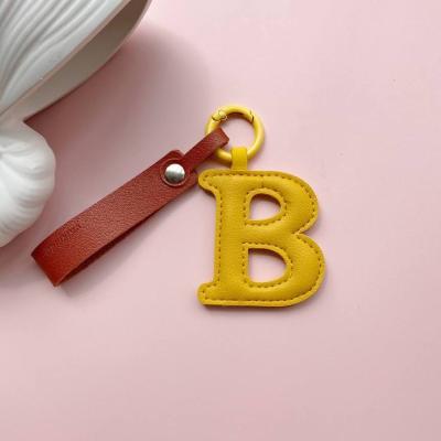 Брелок украшение на сумку Буква B желтая